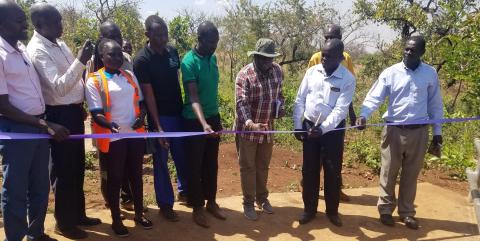 The Deputy Resident district commissioner for kitgum presiding over the commissioning of cattle crash at lalano sub county with support from Care International funded by European Union under the project Development Initiative for Northern Uganda (DINU). the project cost was worth 24.5 million shillings. from right DHO, Hon Sec for production, RDC, LC3, Care staff, contractor, District Engineer and DVO kitgum
commissioning of cattle crash at lalano sub county